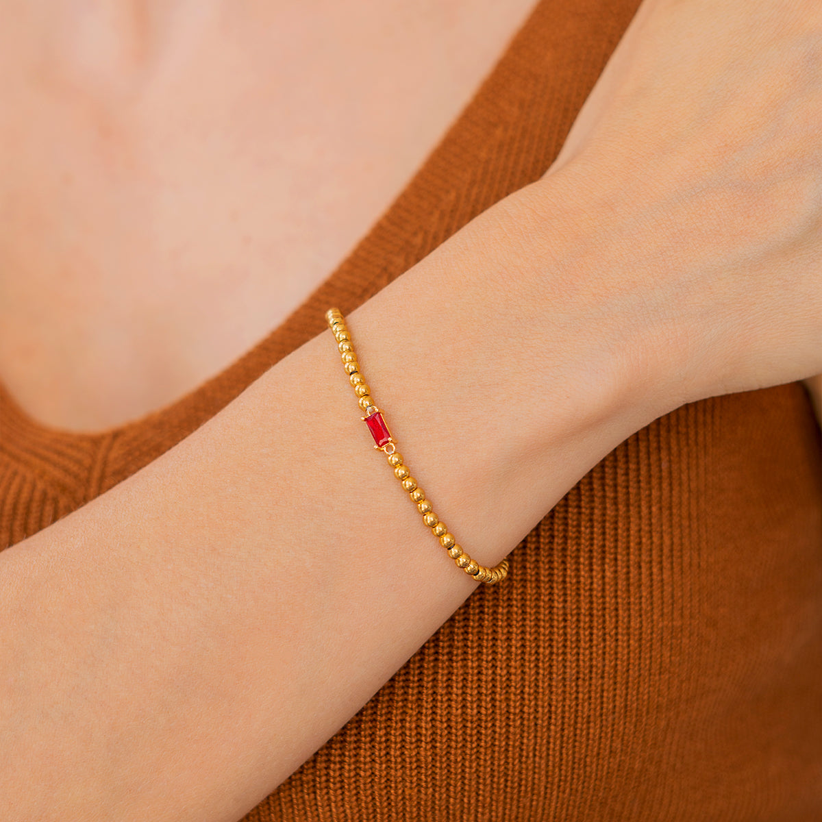 Bracelet of gold beads with birth stone