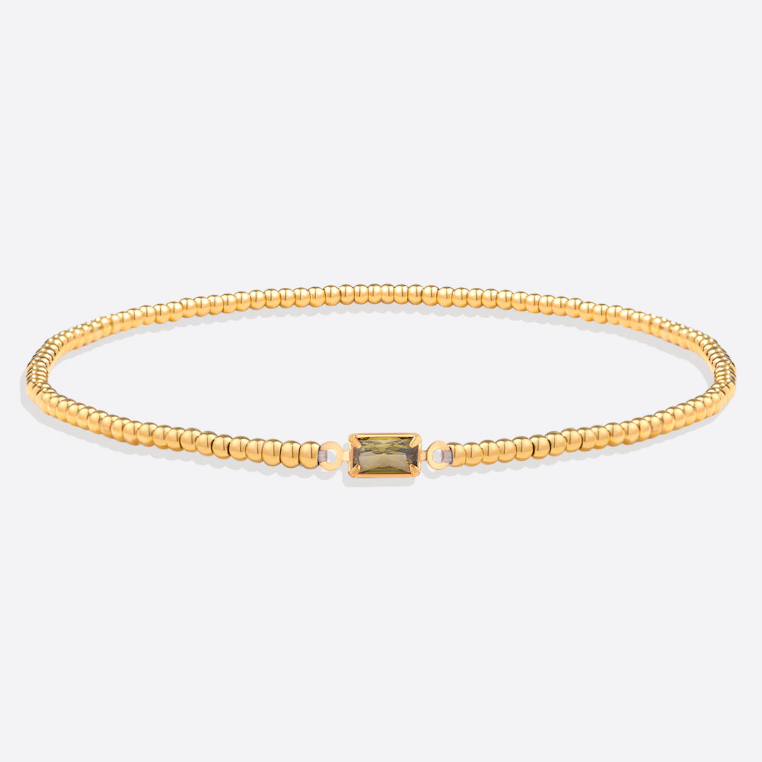 Bracelet of gold beads with birth stone