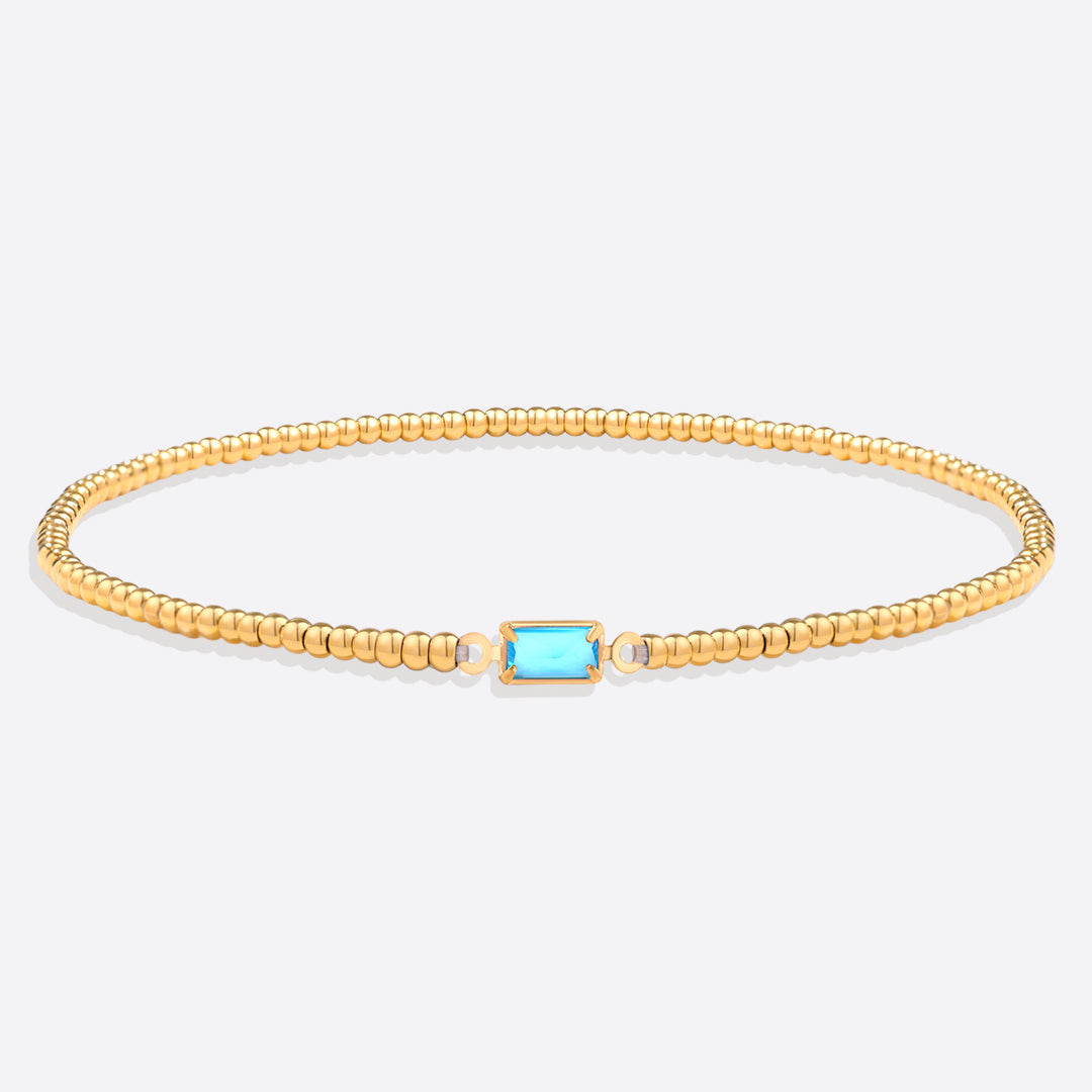Bracelet of gold beads with birth stone