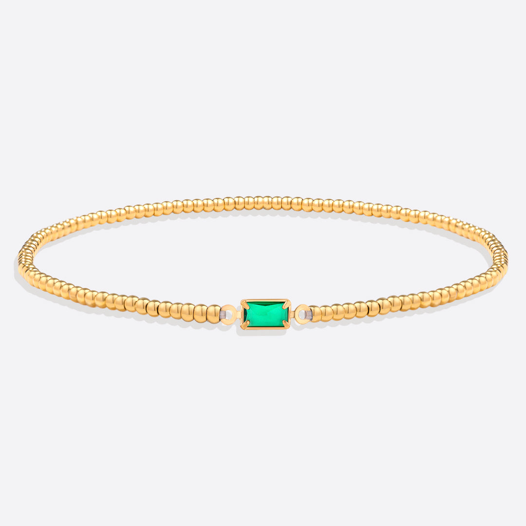 Bracelet of gold beads with birth stone