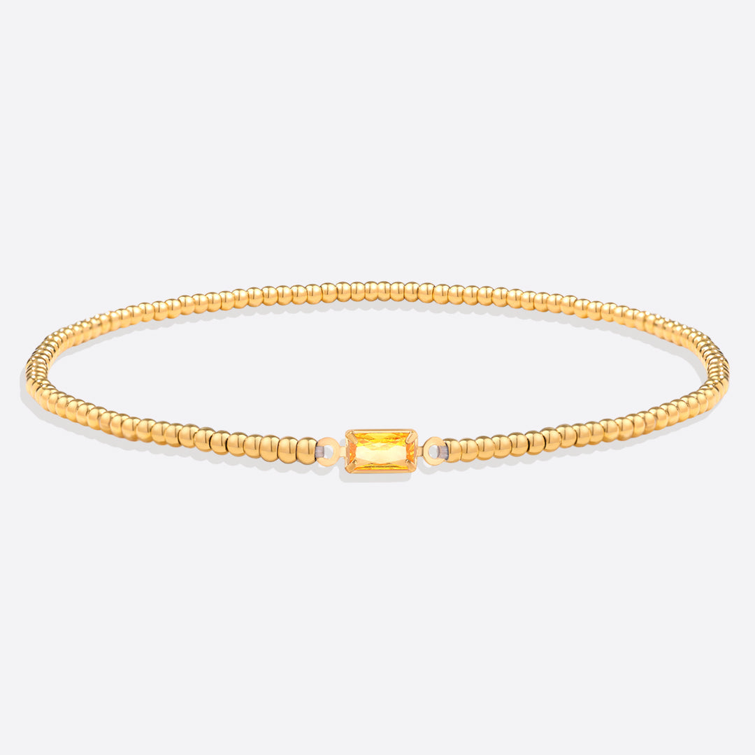 Bracelet of gold beads with birth stone