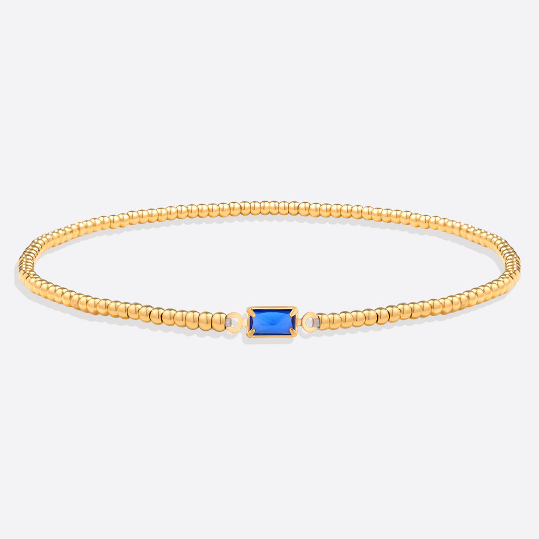 Bracelet of gold beads with birth stone