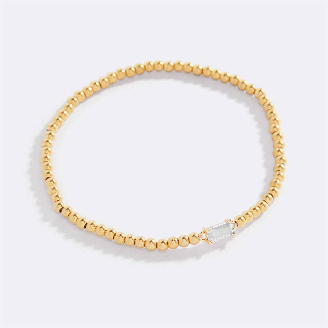 Bracelet of gold beads with birth stone