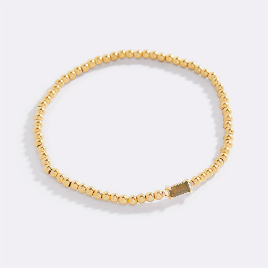 Bracelet of gold beads with birth stone