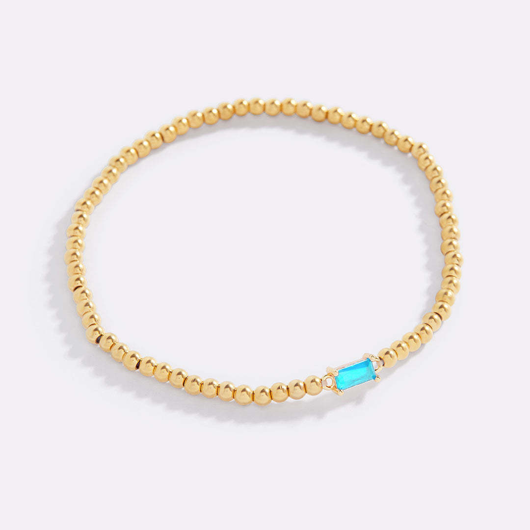 Bracelet of gold beads with birth stone