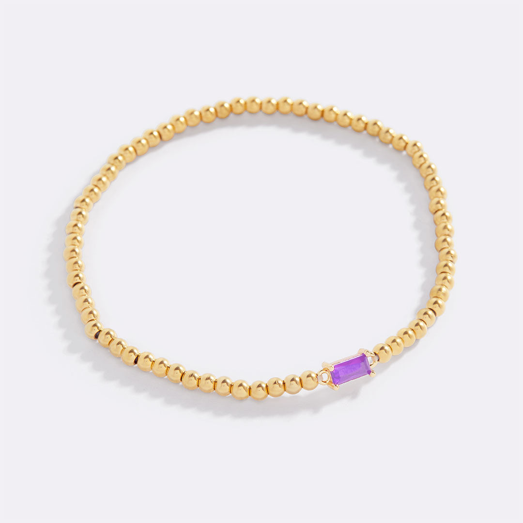 Bracelet of gold beads with birth stone