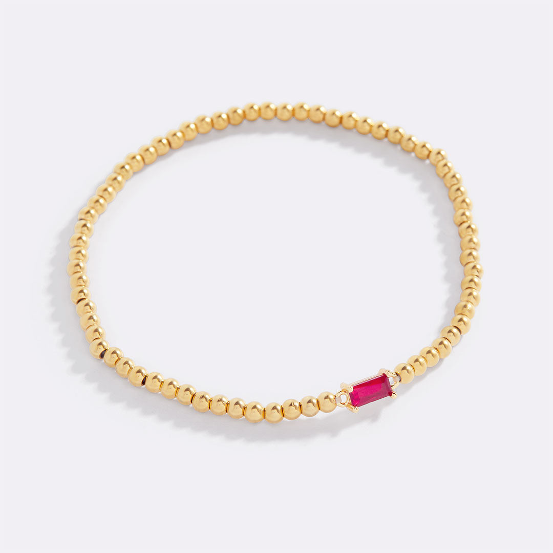 Bracelet of gold beads with birth stone