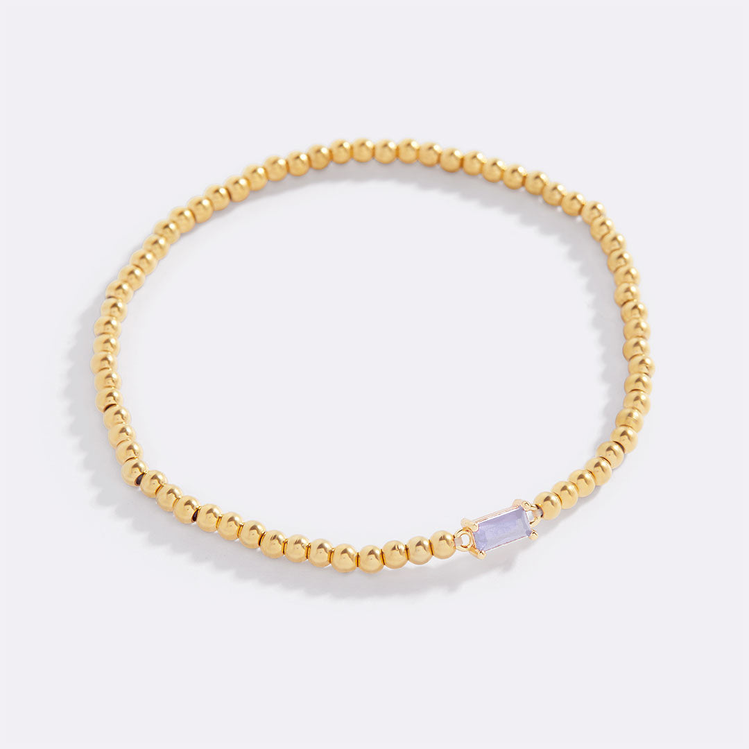 Bracelet of gold beads with birth stone