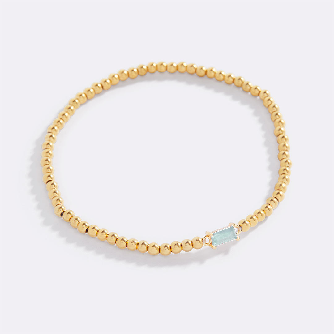 Bracelet of gold beads with birth stone