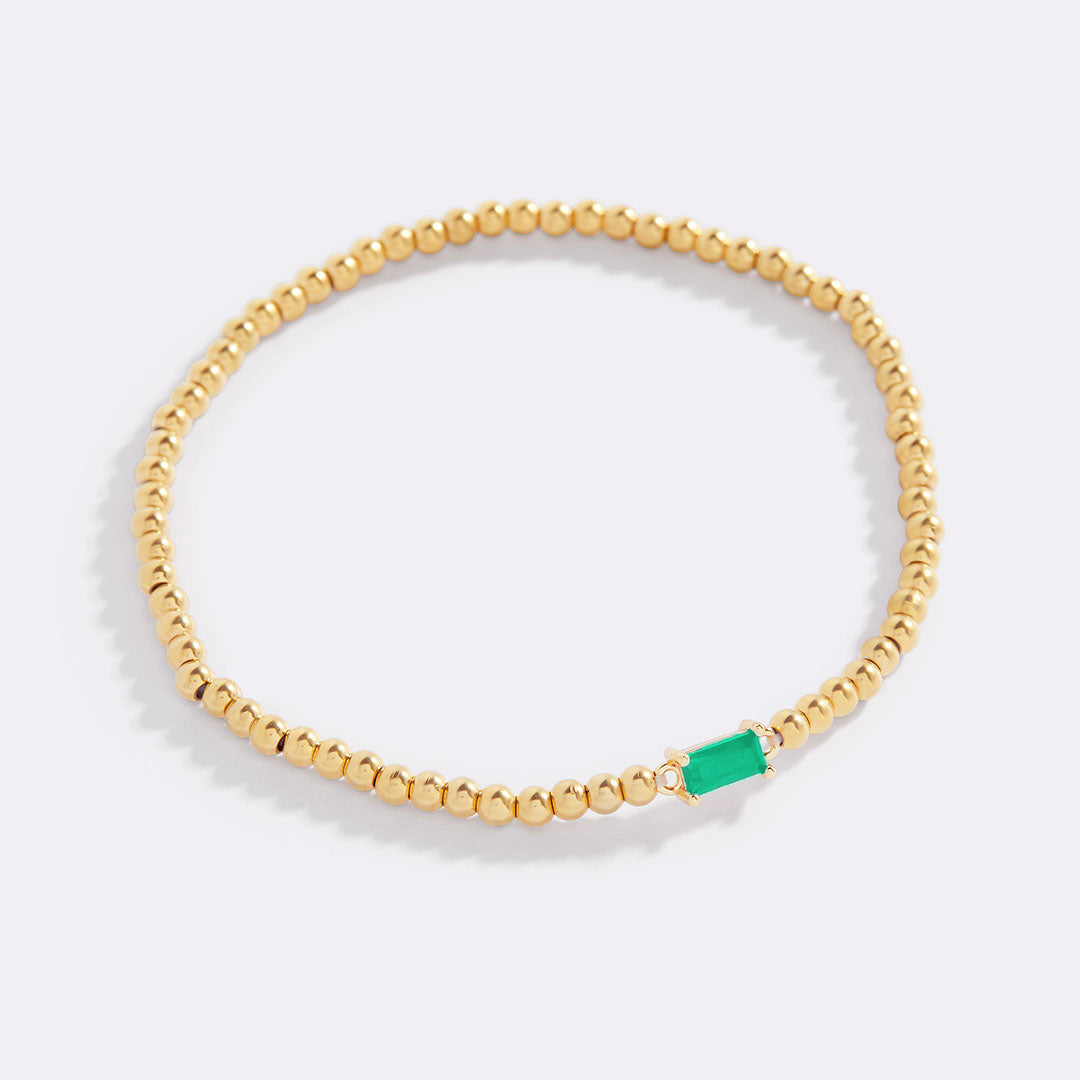 Bracelet of gold beads with birth stone