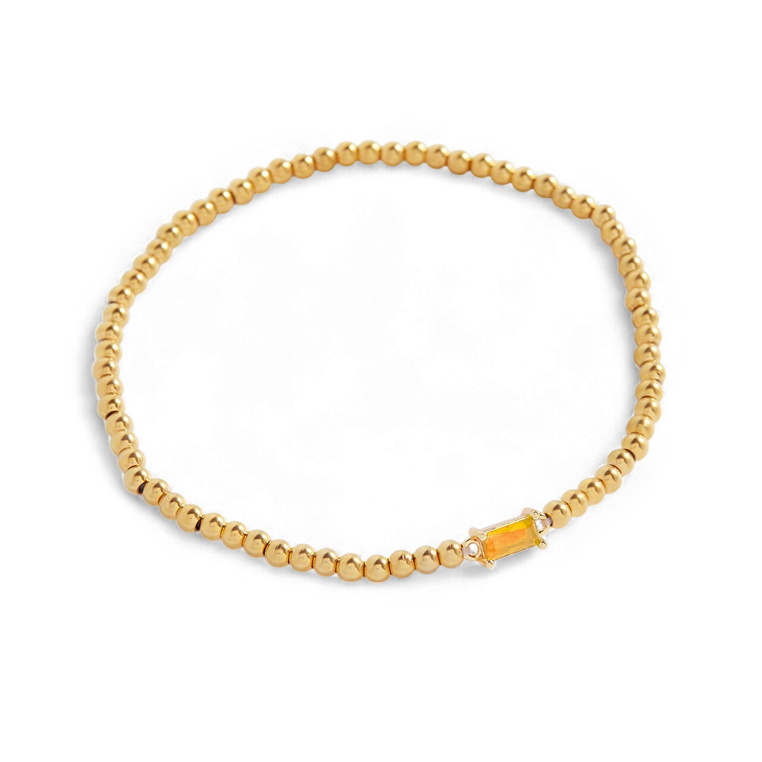 Bracelet of gold beads with birth stone
