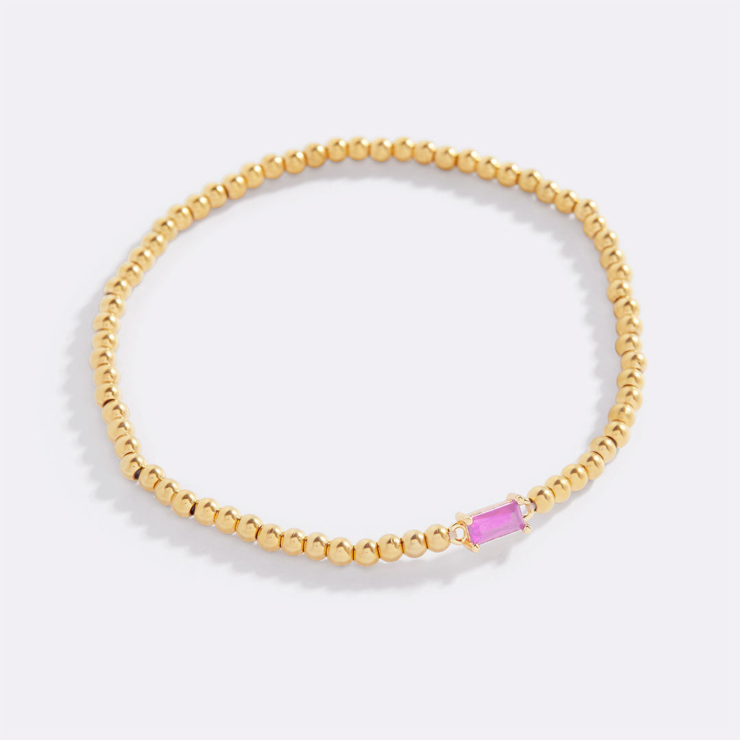 Bracelet of gold beads with birth stone