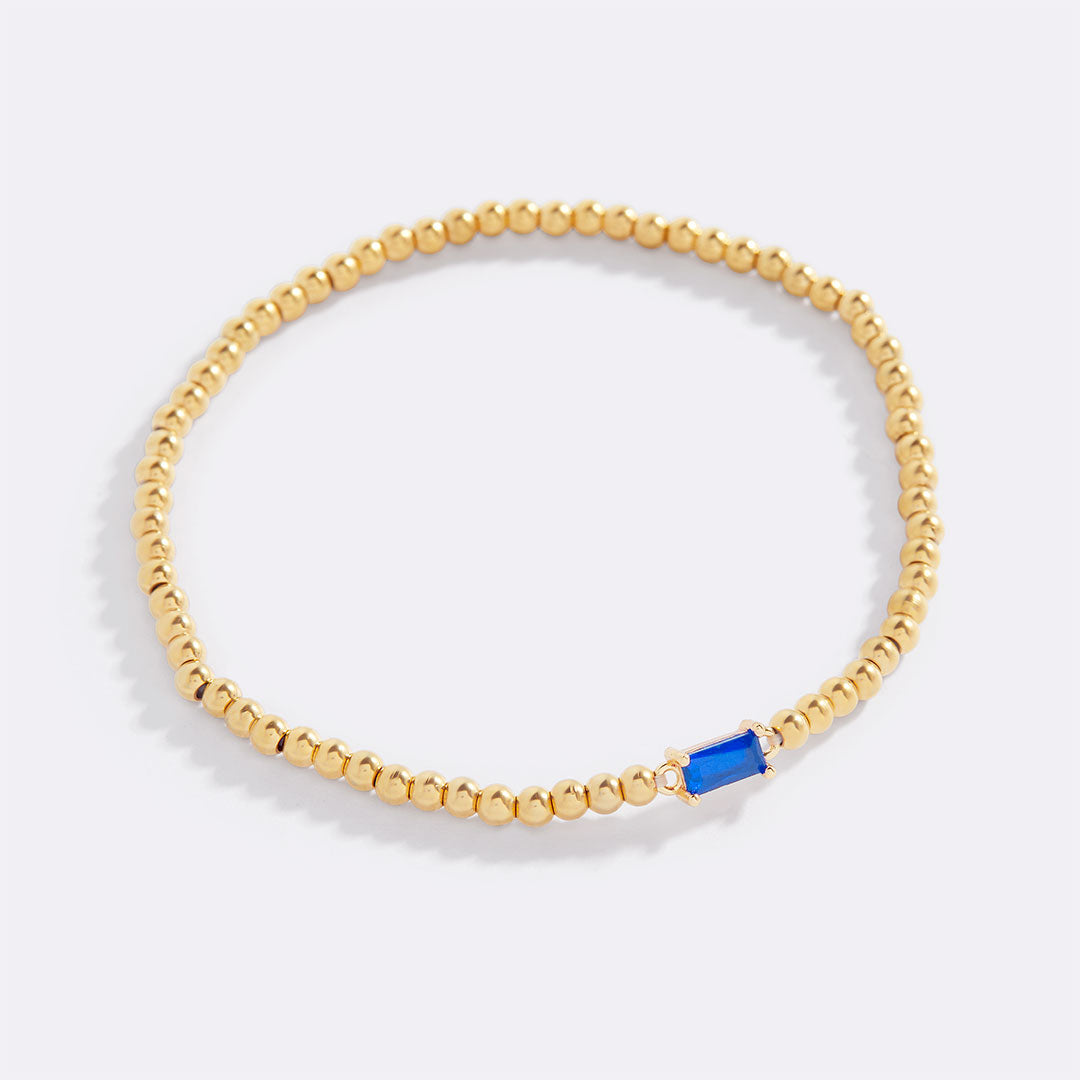 Bracelet of gold beads with birth stone