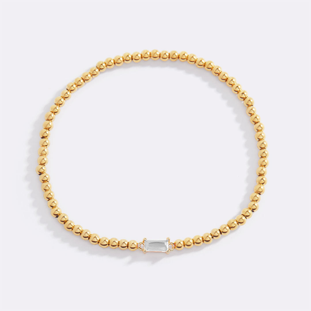 Bracelet of gold beads with birth stone