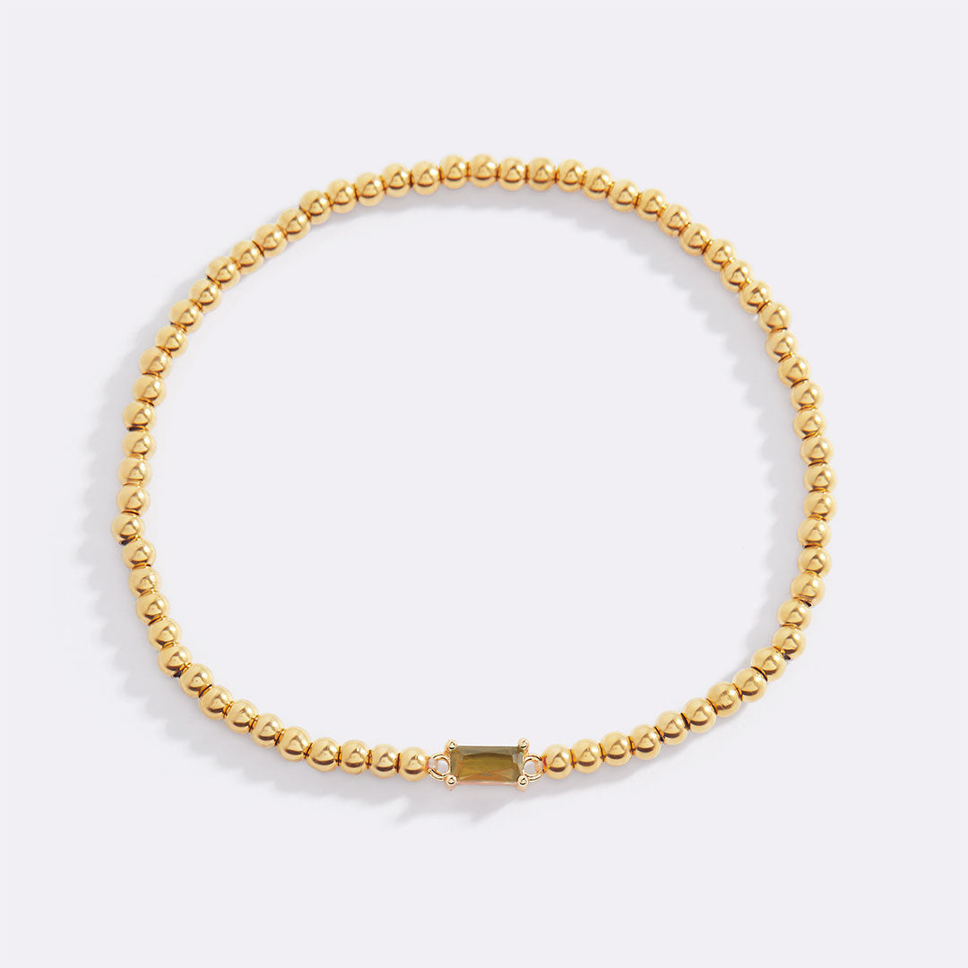 Bracelet of gold beads with birth stone