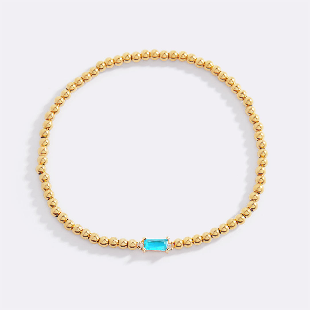 Bracelet of gold beads with birth stone