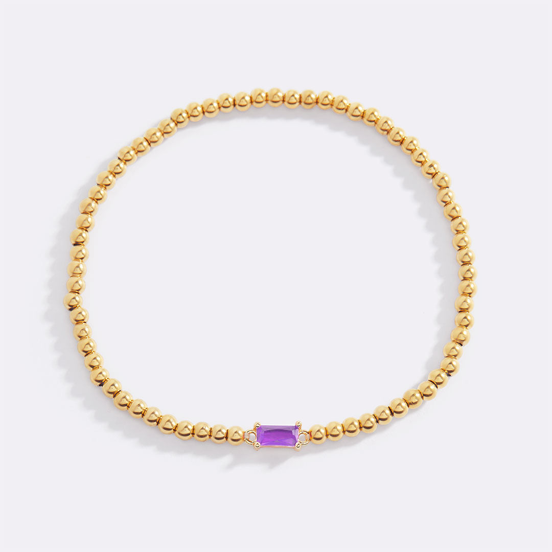 Bracelet of gold beads with birth stone