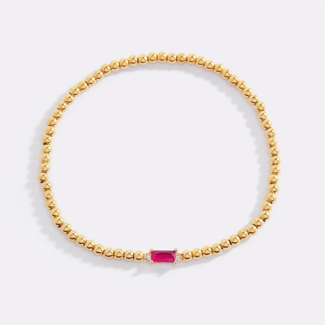 Bracelet of gold beads with birth stone