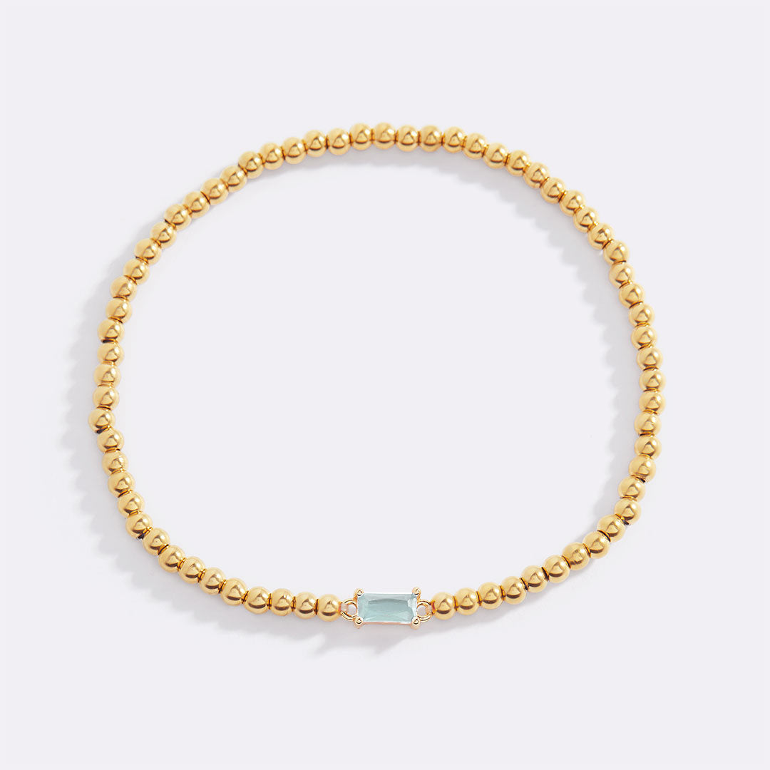Bracelet of gold beads with birth stone