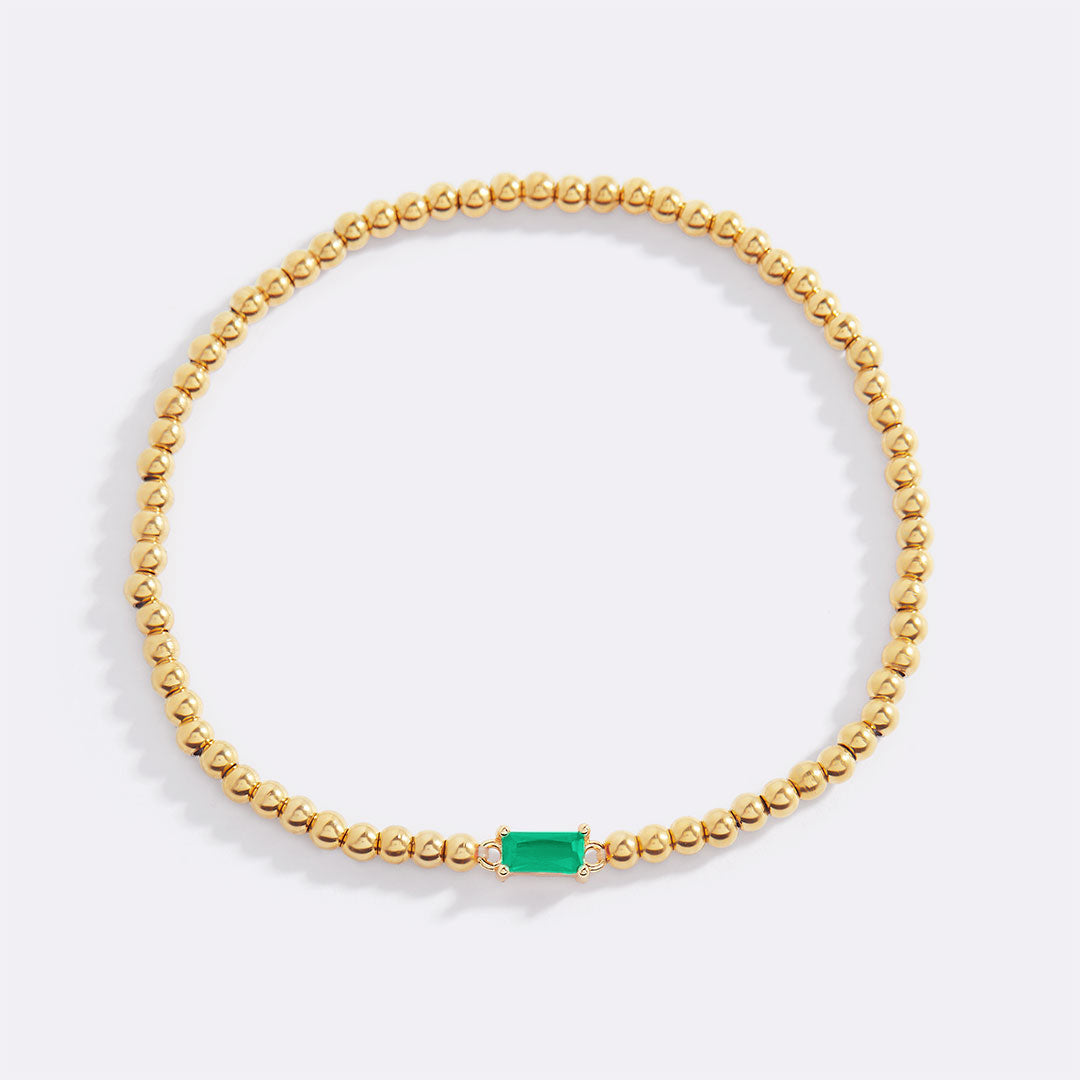 Bracelet of gold beads with birth stone