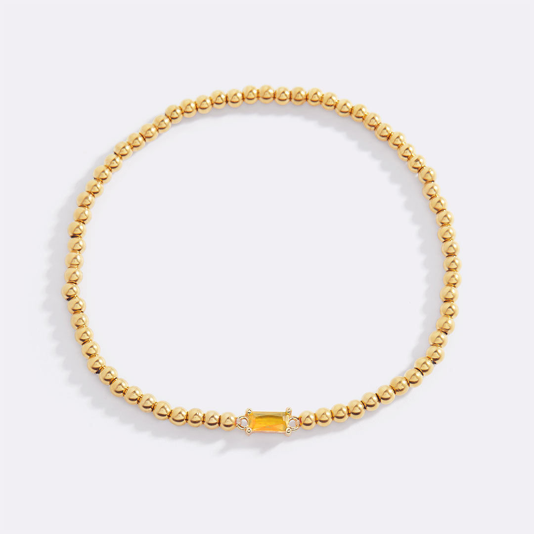 Bracelet of gold beads with birth stone