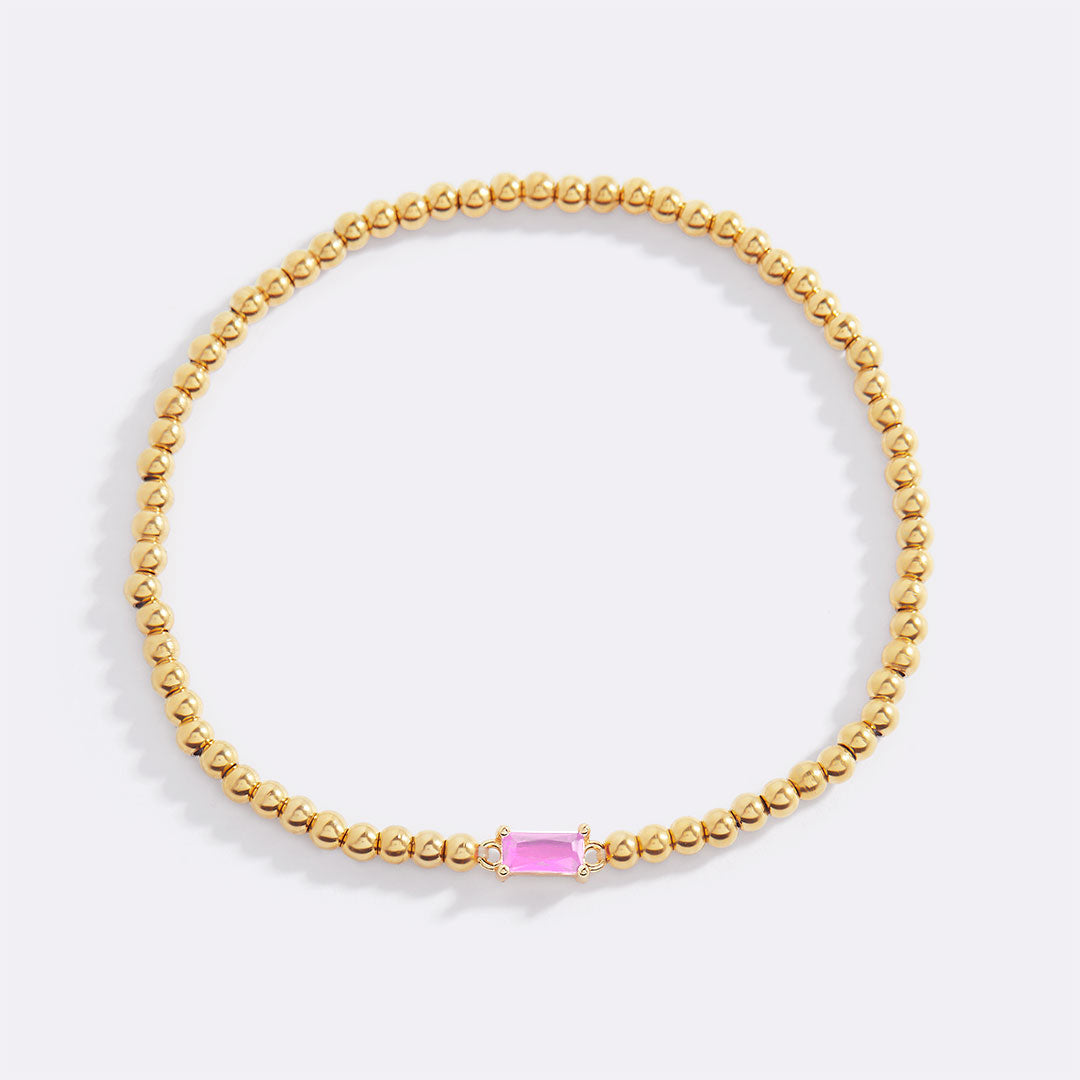 Bracelet of gold beads with birth stone