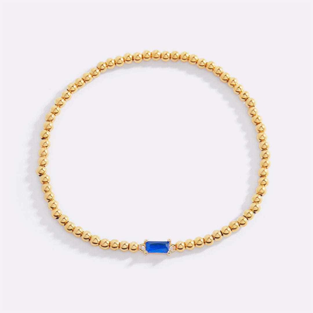 Bracelet of gold beads with birth stone