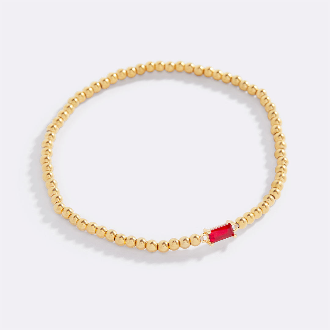 Bracelet of gold beads with birth stone