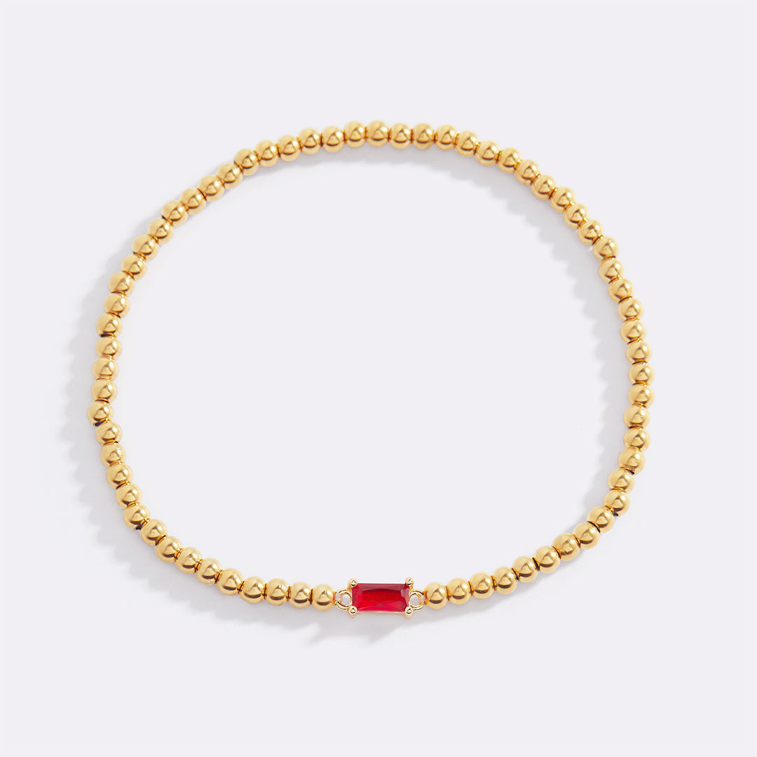 Bracelet of gold beads with birth stone