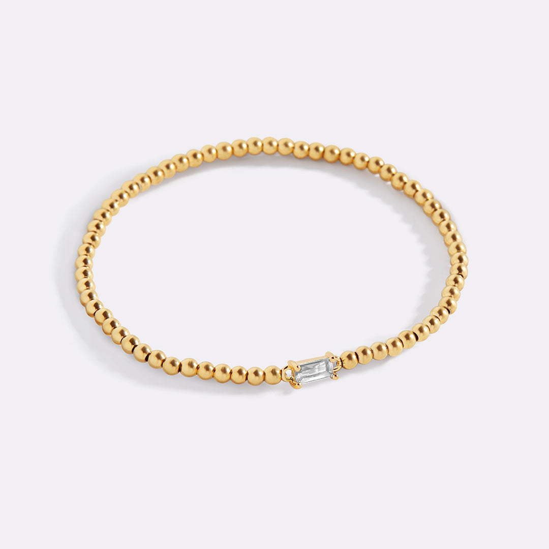 Bracelet of gold beads with birth stone