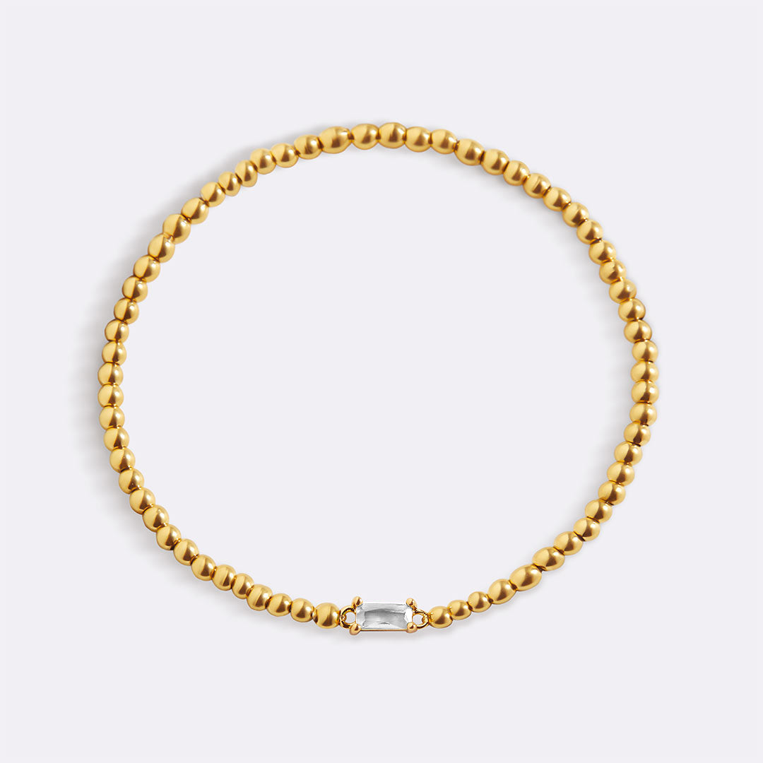 Bracelet of gold beads with birth stone