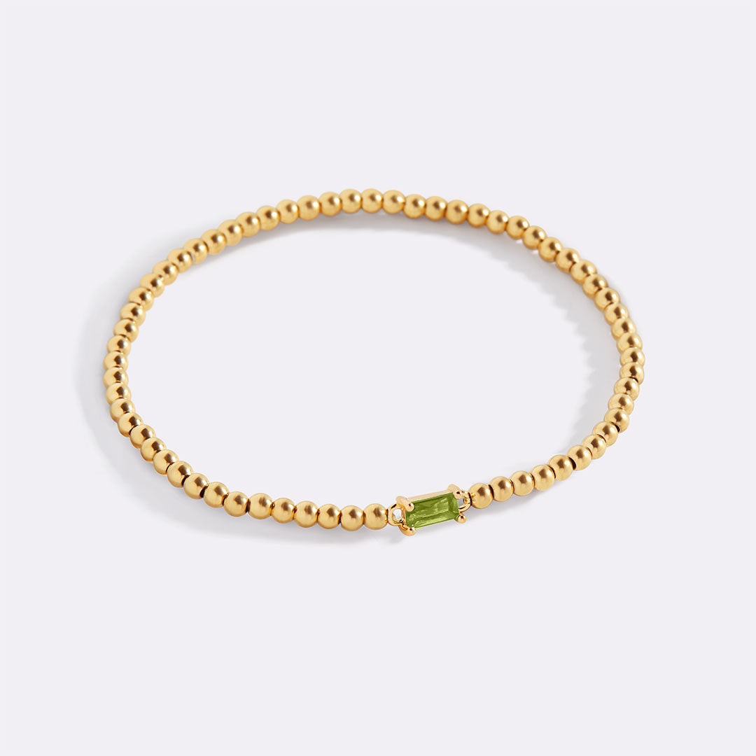 Bracelet of gold beads with birth stone