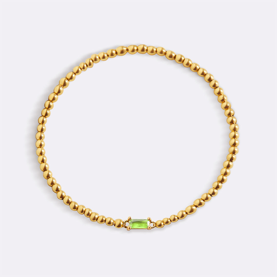 Bracelet of gold beads with birth stone