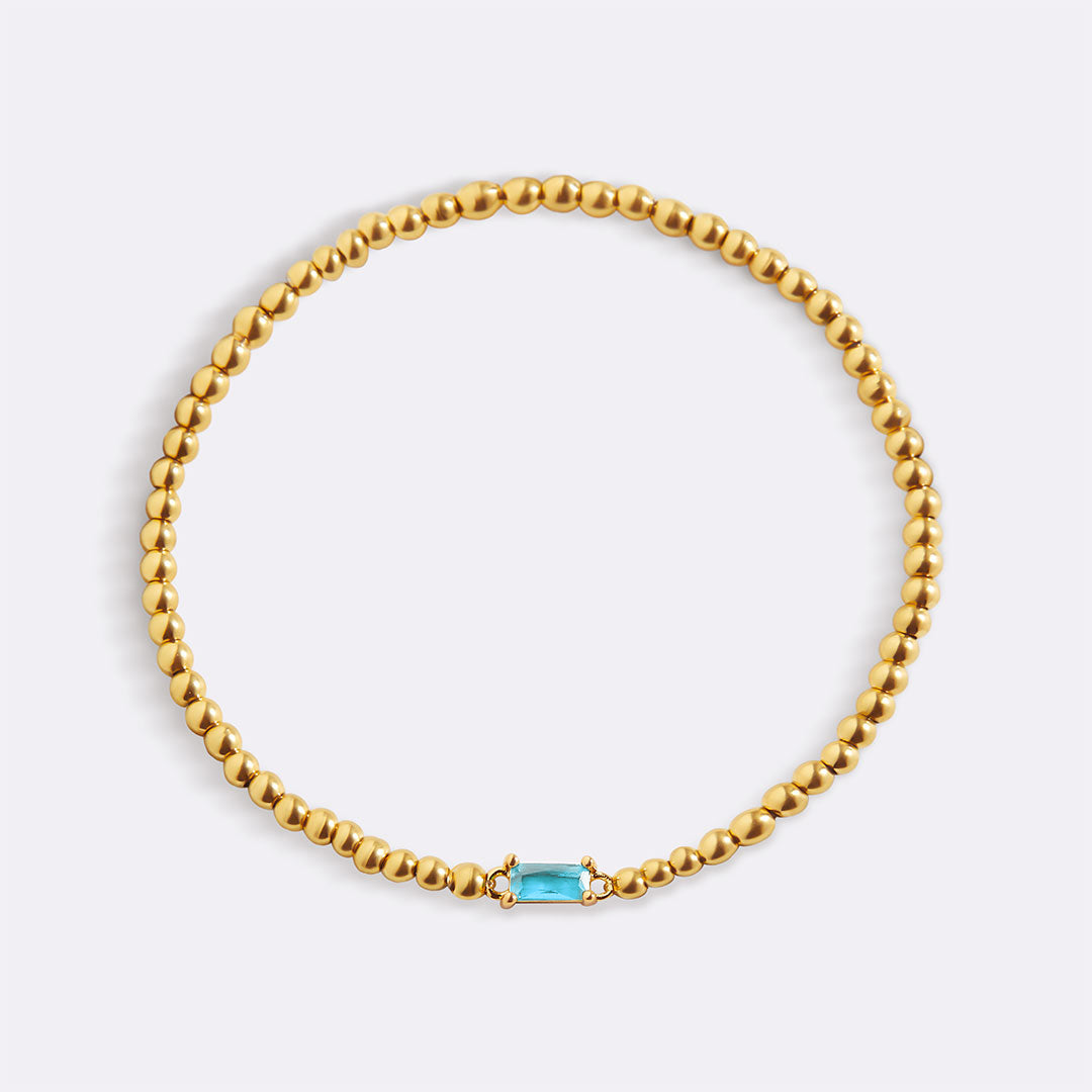 Bracelet of gold beads with birth stone