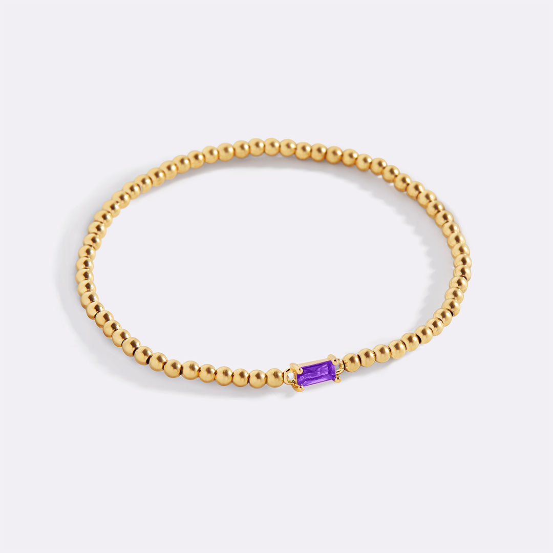 Bracelet of gold beads with birth stone