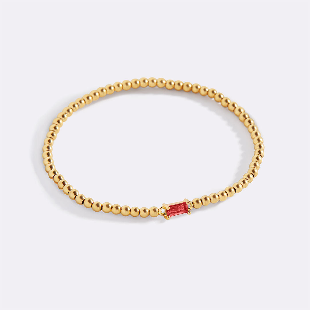 Bracelet of gold beads with birth stone