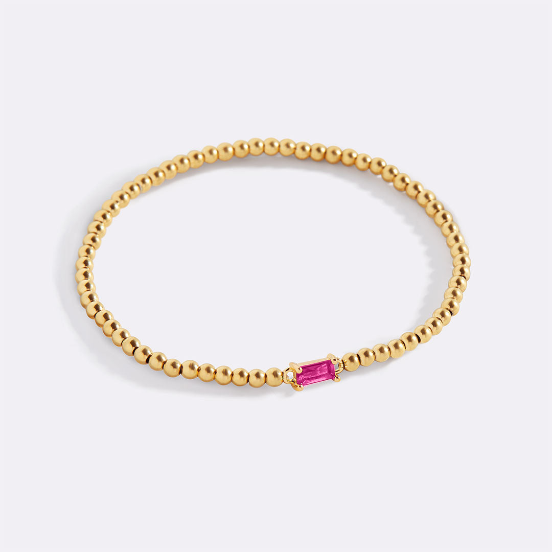 Bracelet of gold beads with birth stone