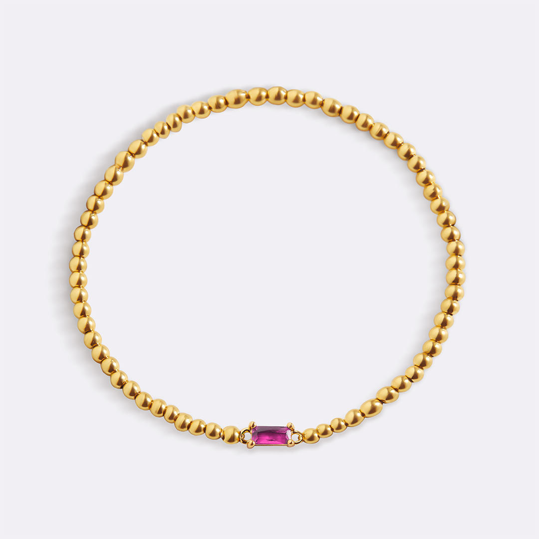 Bracelet of gold beads with birth stone