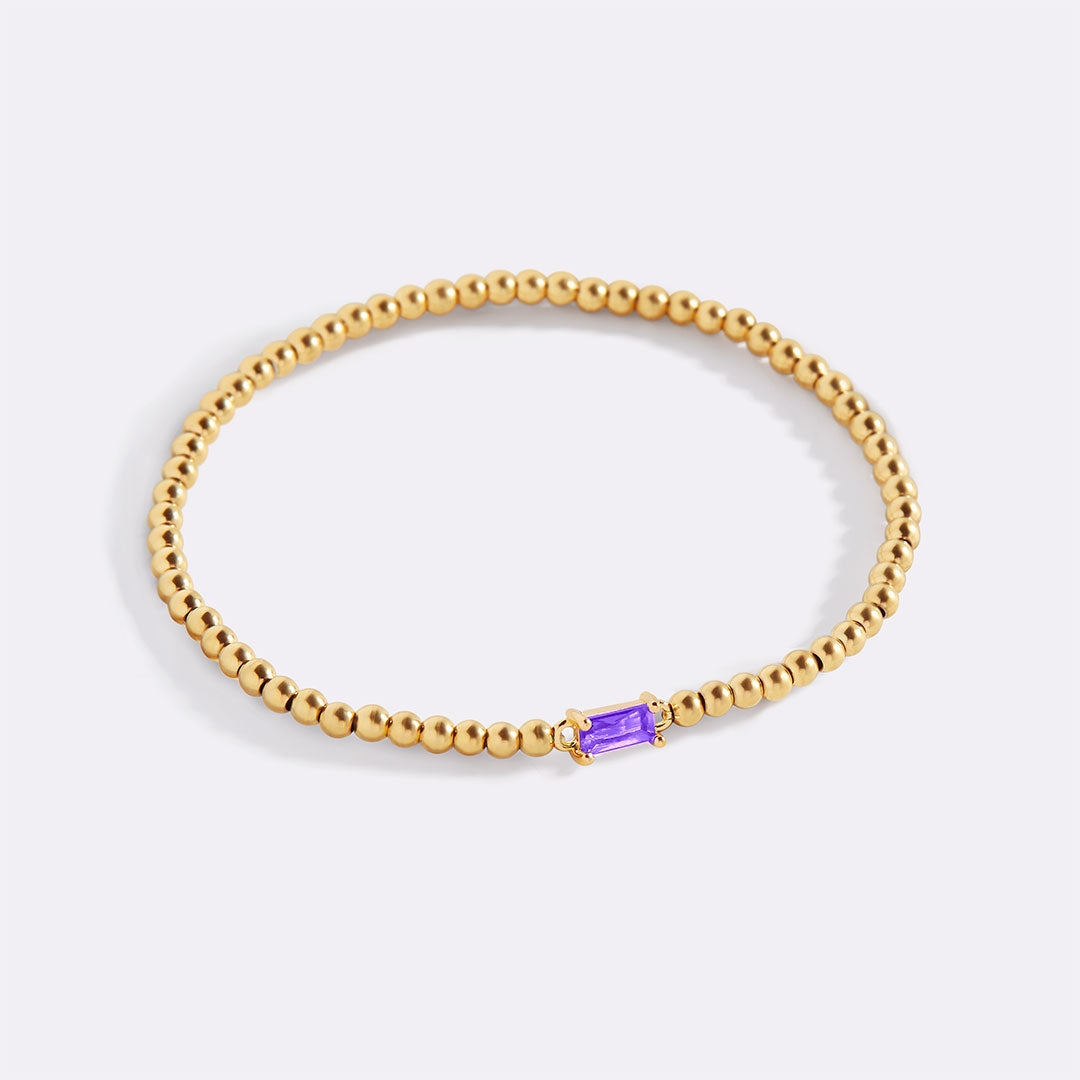 Bracelet of gold beads with birth stone
