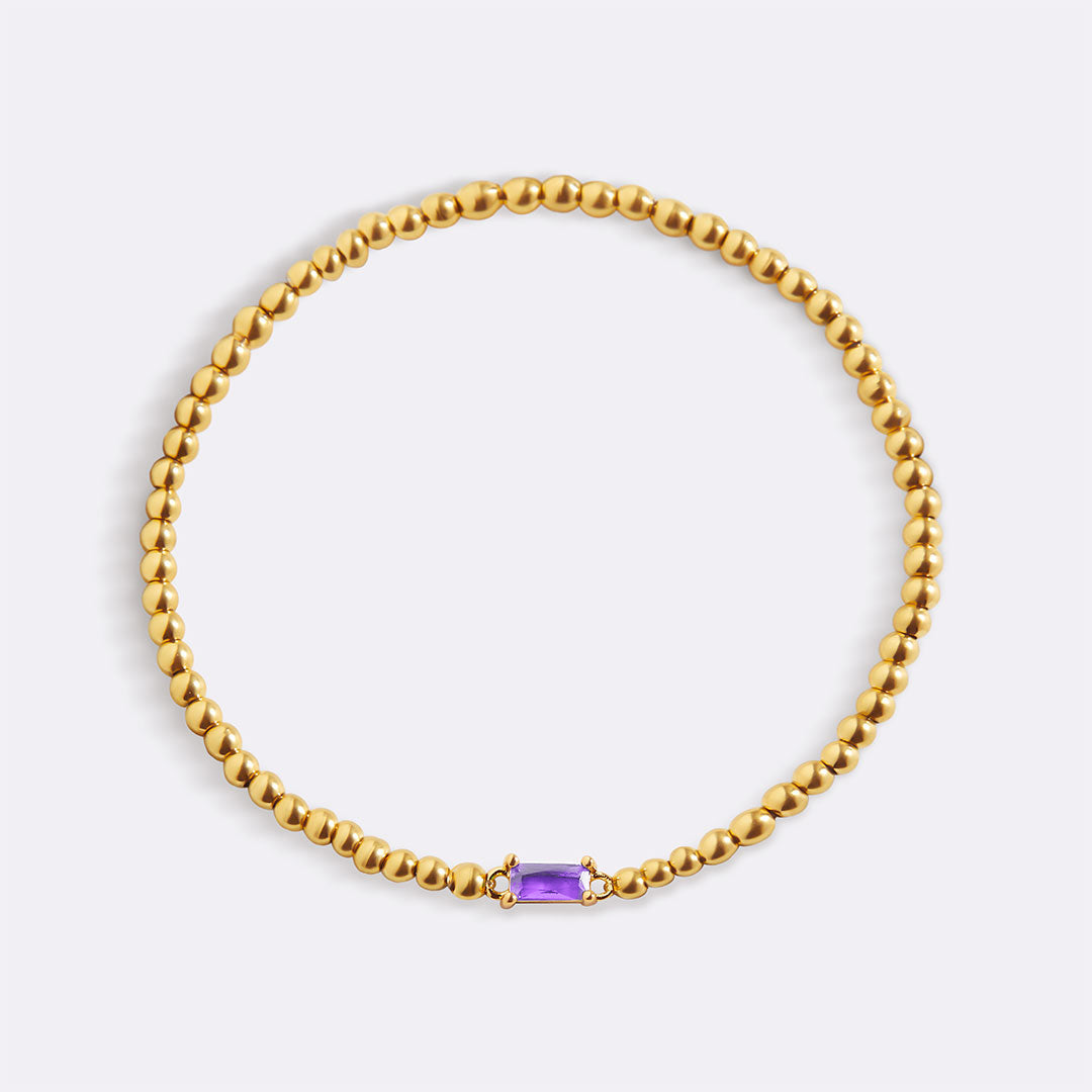 Bracelet of gold beads with birth stone
