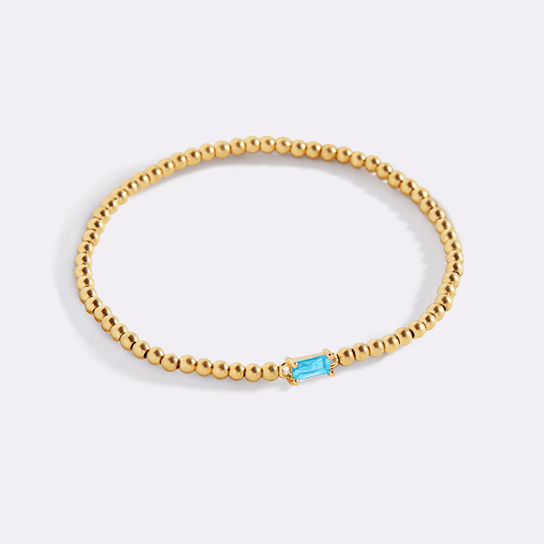 Bracelet of gold beads with birth stone