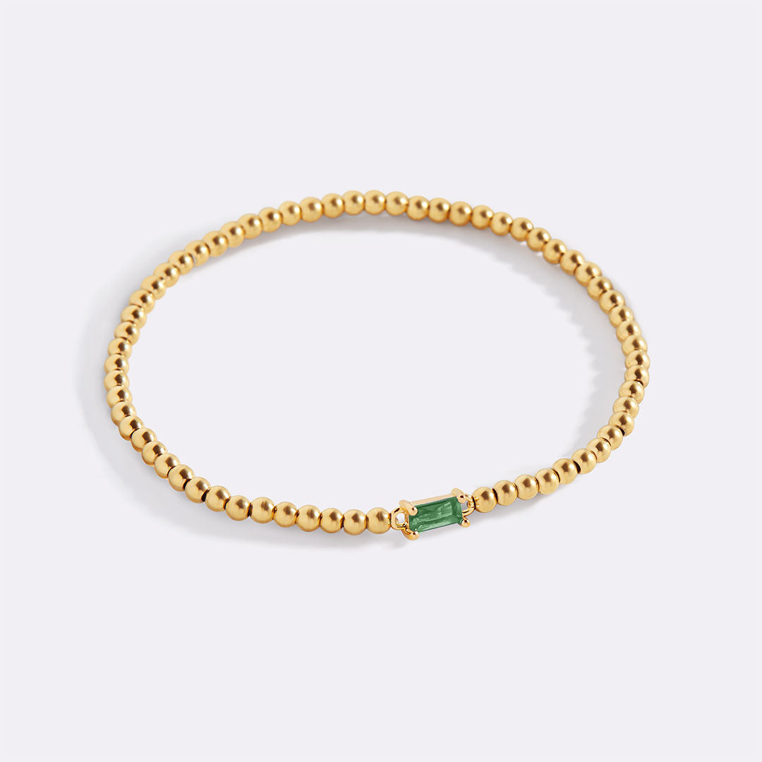 Bracelet of gold beads with birth stone