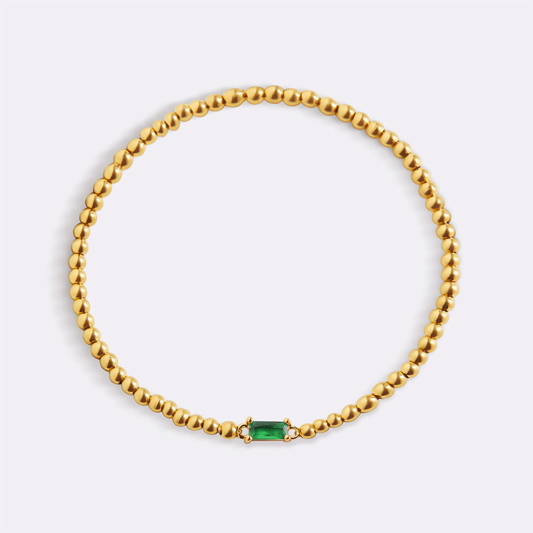 Bracelet of gold beads with birth stone