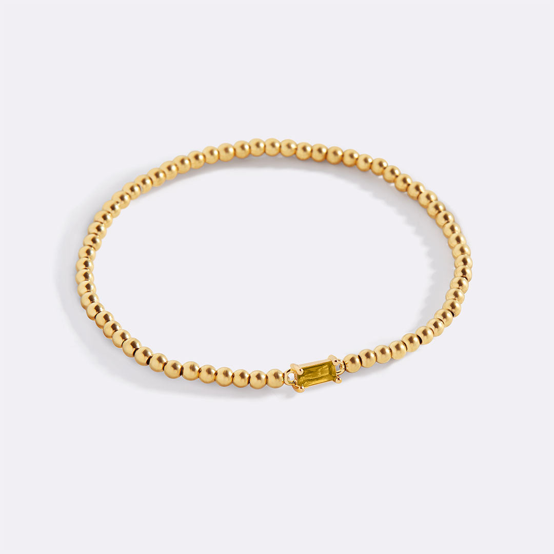 Bracelet of gold beads with birth stone