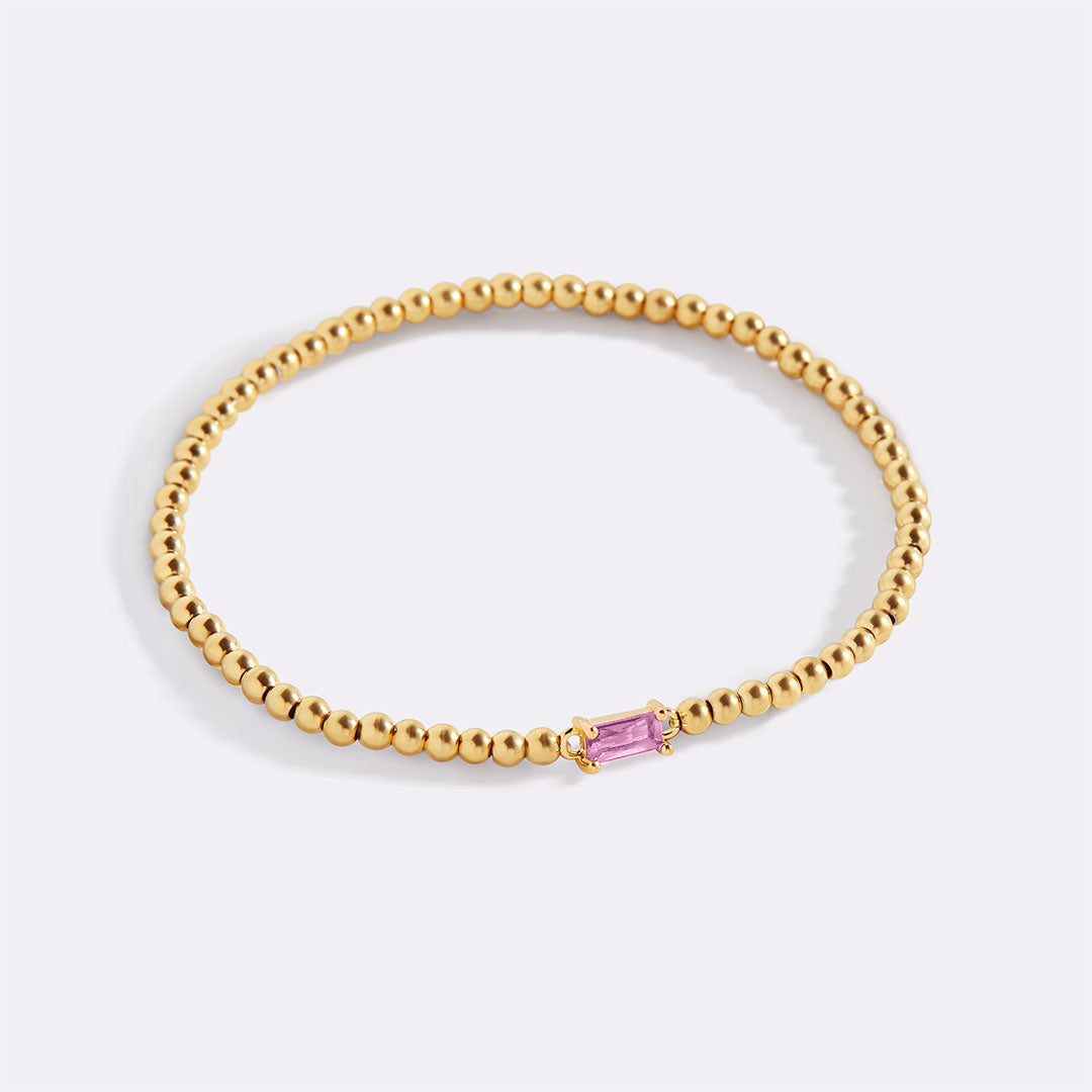 Bracelet of gold beads with birth stone