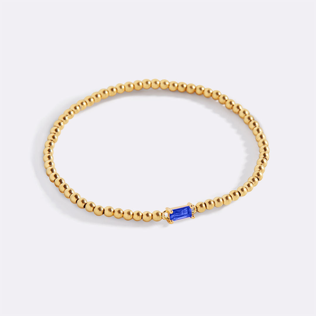 Bracelet of gold beads with birth stone