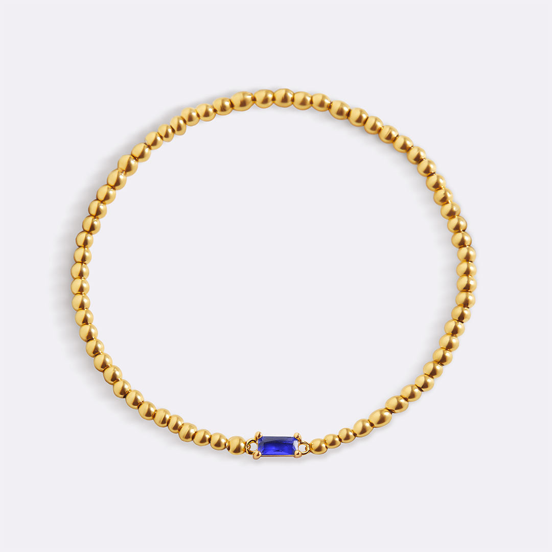 Bracelet of gold beads with birth stone