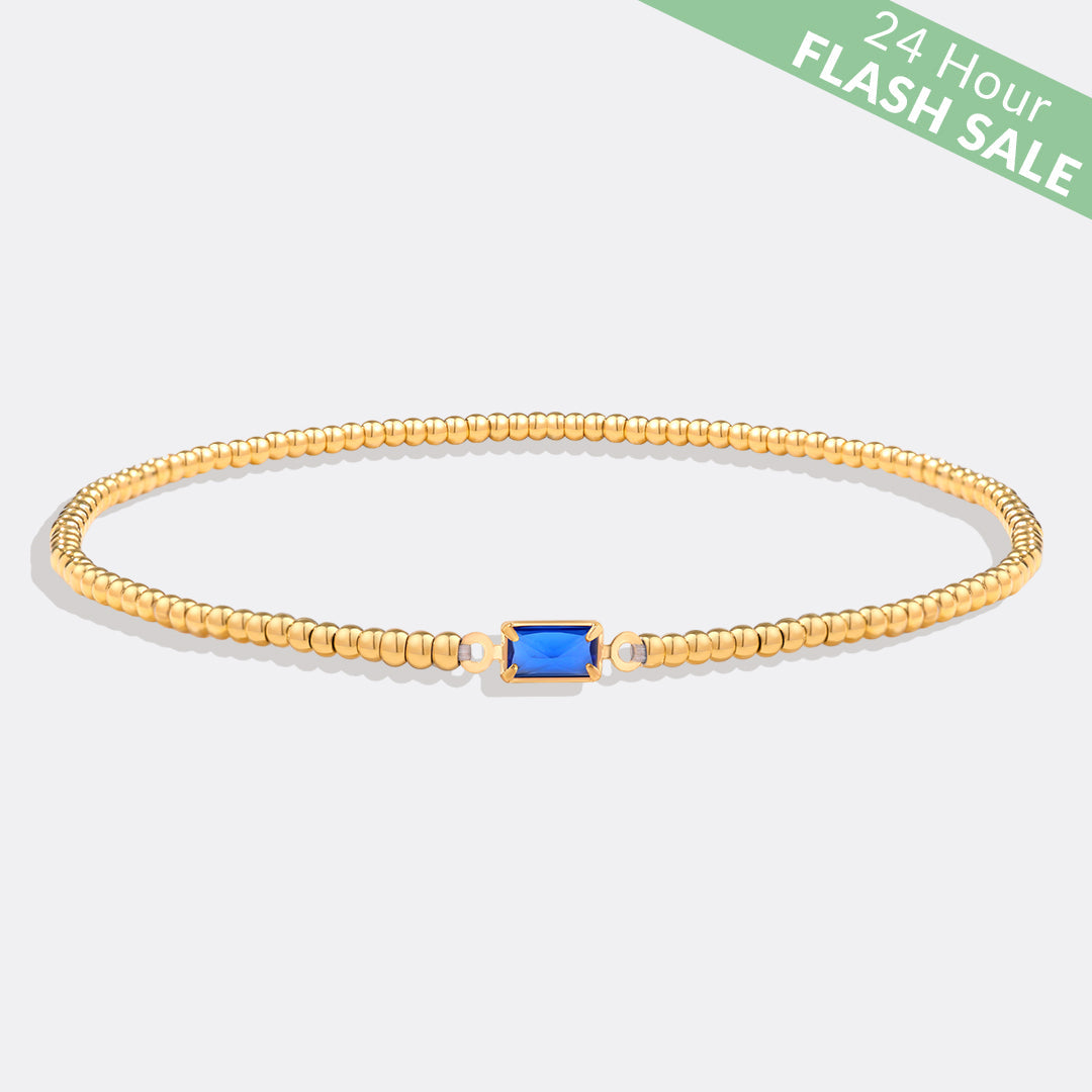 Bracelet of gold beads with birth stone