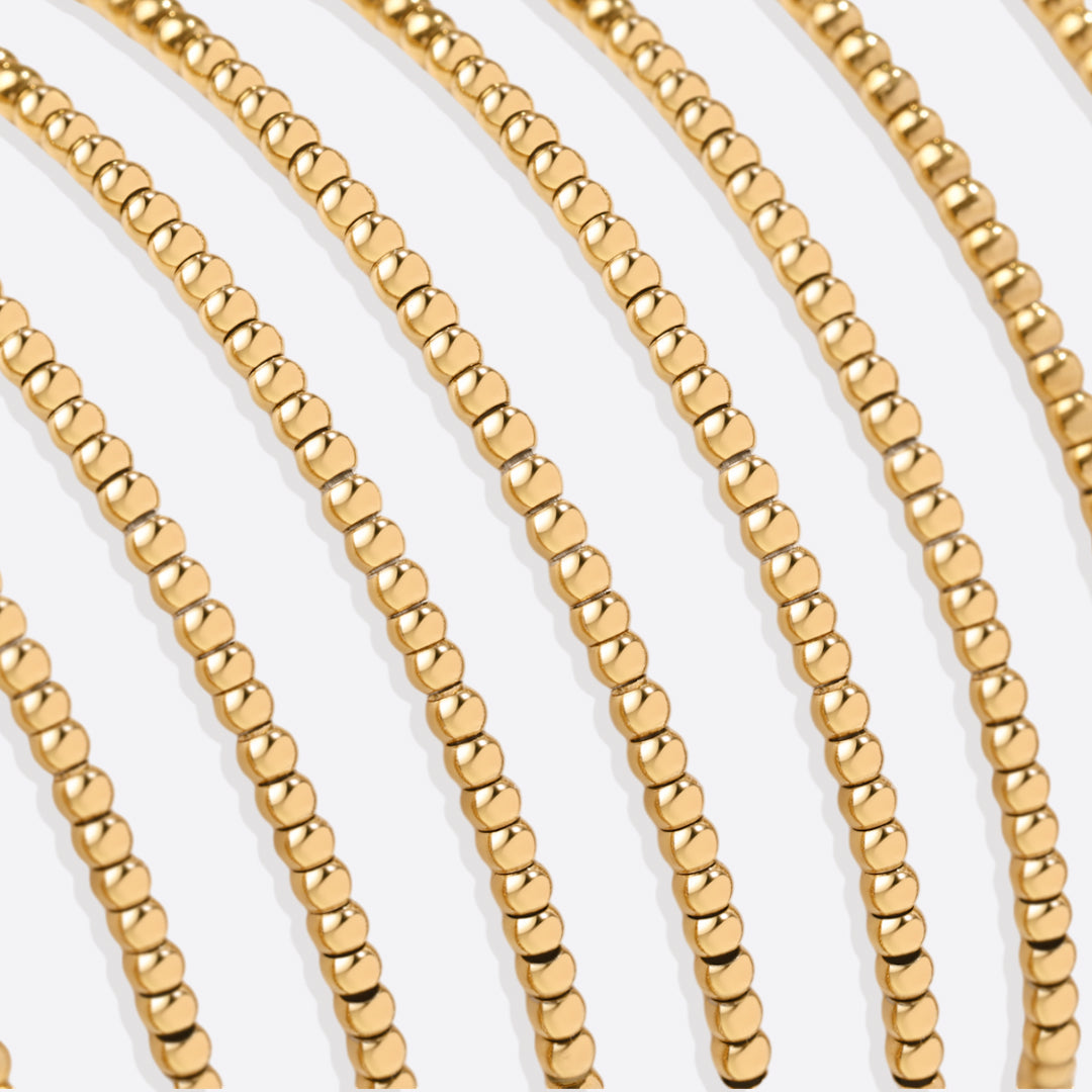 Bracelet of gold beads with birth stone