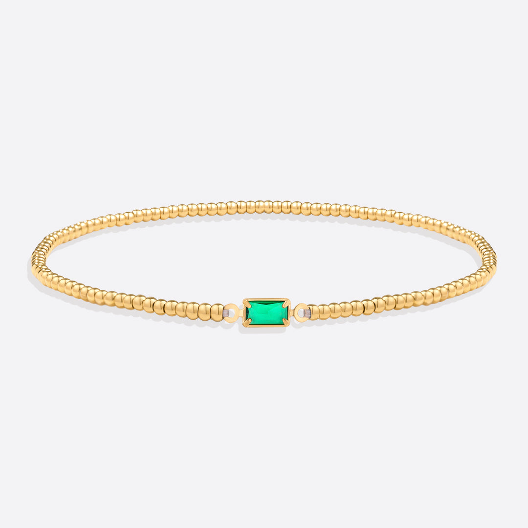 Bracelet of gold beads with birth stone